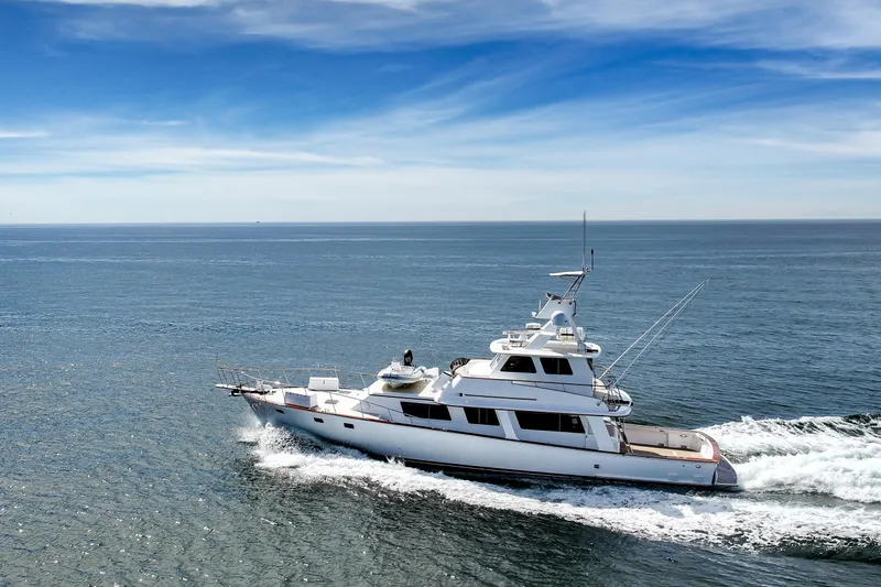 Slide: The Image of 1970 Hargrave Yachtfisher cruising on open sea under clear blue sky. - 20