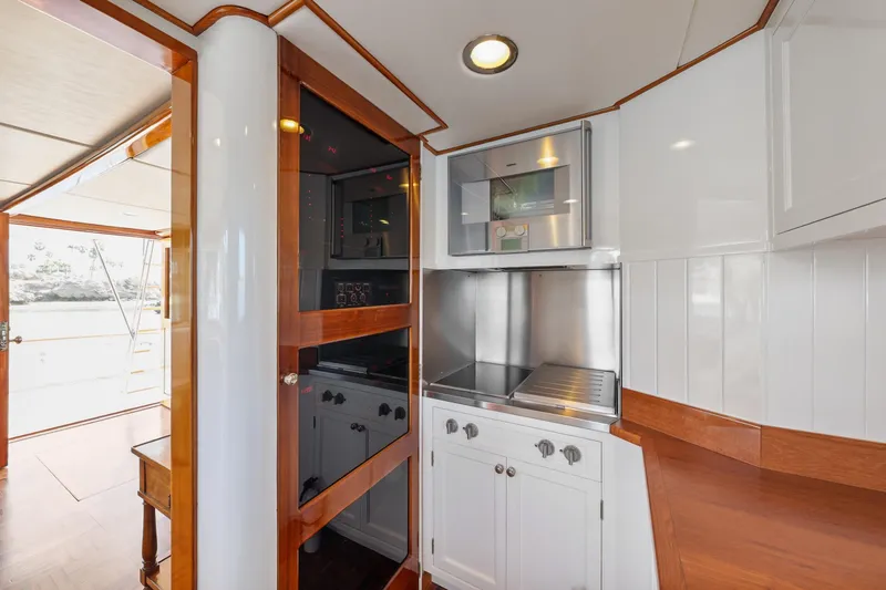 Slide: The Image of 1970 Hargrave Yachtfisher kitchen with modern appliances and wooden accents. - 32