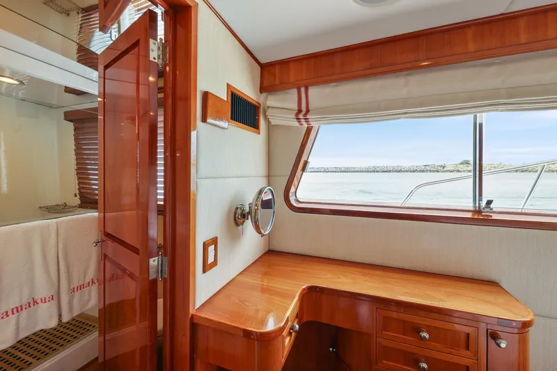 Slide: The Image of Interior of 1970 Hargrave Yachtfisher with wooden desk and ocean view window. - 42