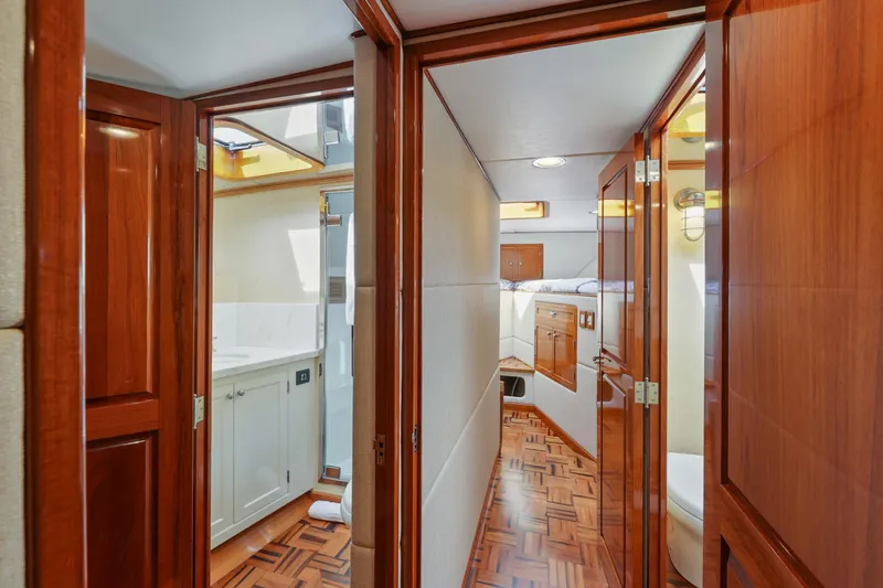 Slide: The Image of 1970 Hargrave Yachtfisher interior with wood paneling, bathroom, and cabin view. - 44