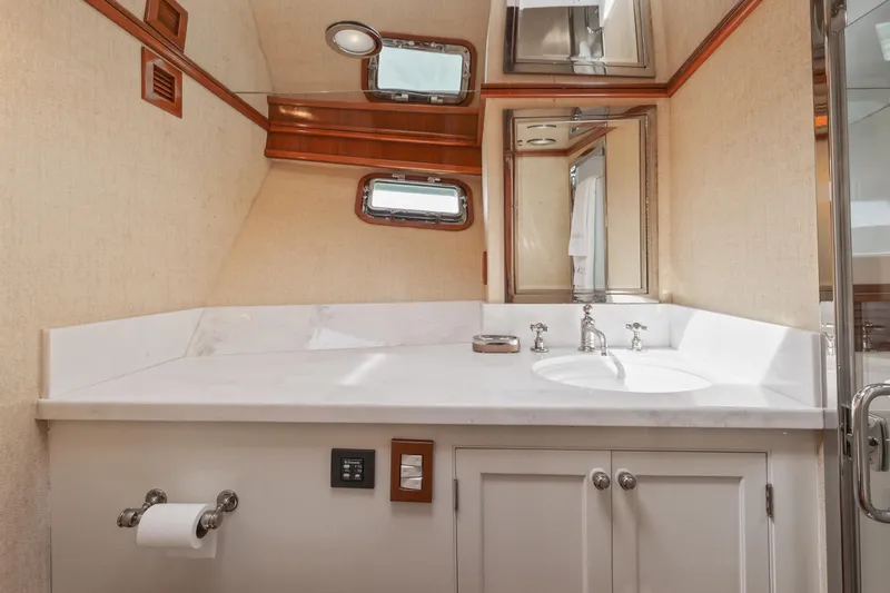 Slide: The Image of Luxurious bathroom on a 1970 Hargrave Yachtfisher, featuring elegant fixtures and a sleek design. - 48