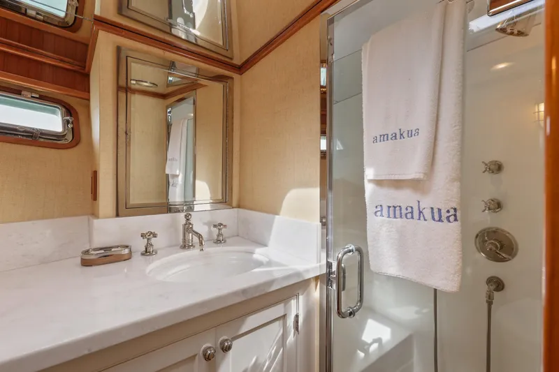 Slide: The Image of Luxurious bathroom on 1970 Hargrave Yachtfisher with elegant fixtures and mirrored cabinets. - 49