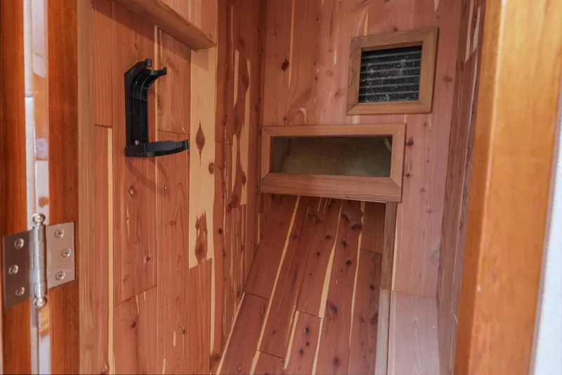 Slide: The Image of Wood-paneled interior of a 1970 Hargrave Yachtfisher, featuring a vent and storage space. - 50