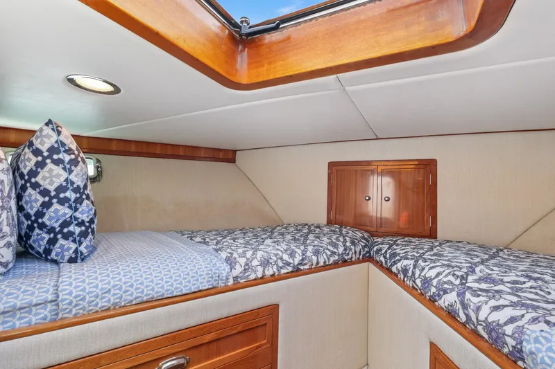 Slide: The Image of 1970 Hargrave Yachtfisher cabin interior with twin beds and decorative pillows. - 51