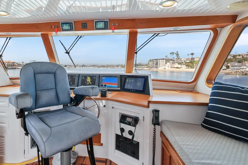 Slide: The Image of Interior of 1970 Hargrave Yachtfisher helm with navigation equipment and panoramic windows. - 56