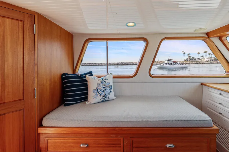 Slide: The Image of Cozy cabin interior of 1970 Hargrave Yachtfisher with scenic ocean view through windows. - 59