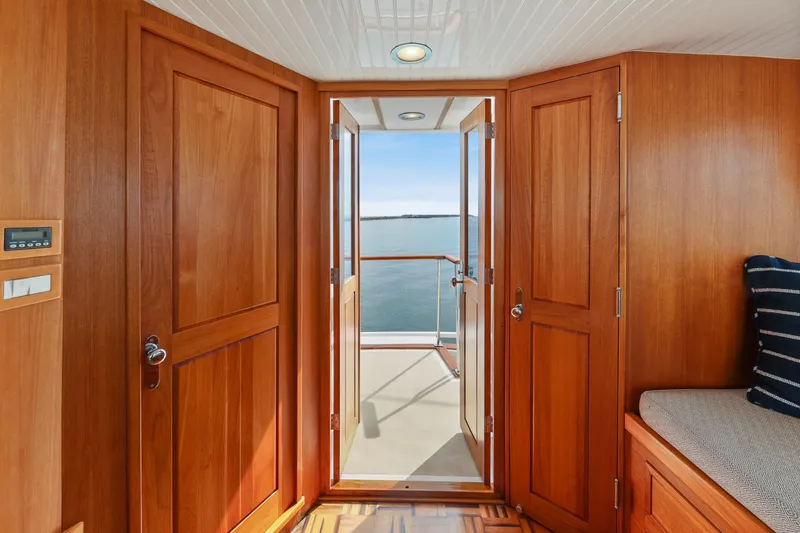 Slide: The Image of Interior view of 1970 Hargrave Yachtfisher with wooden doors and ocean view. - 60