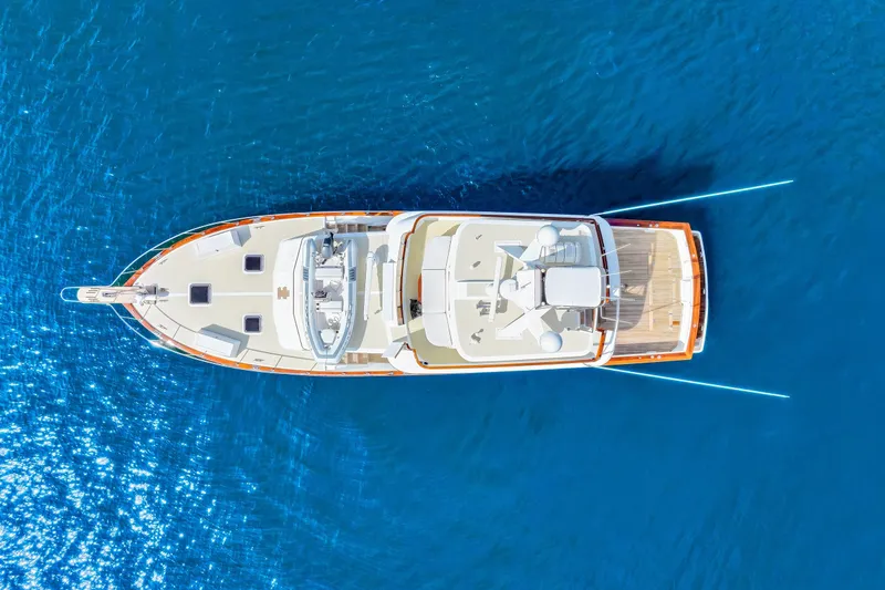 Slide: The Image of Aerial view of 1970 Hargrave Yachtfisher on clear blue water. - 7