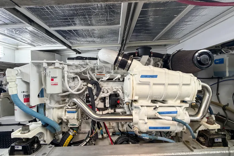 Slide: The Image of Engine room of a 1970 Hargrave Yachtfisher, showcasing detailed mechanical components. - 74