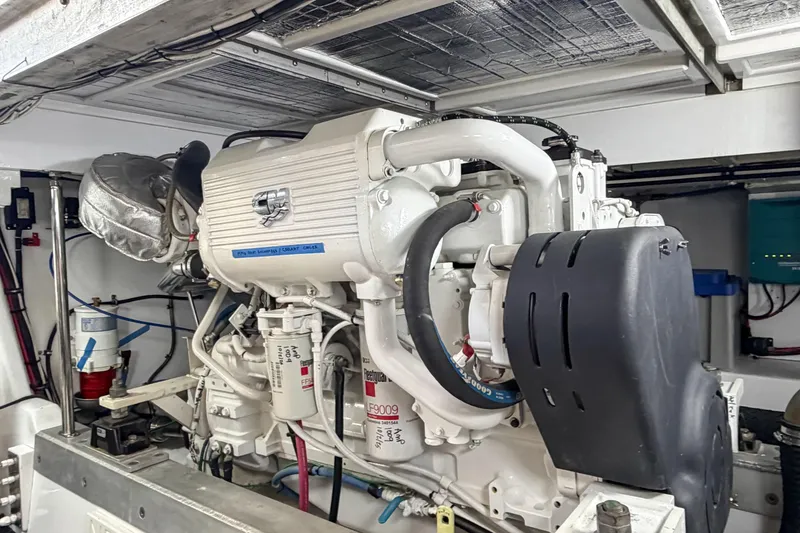Slide: The Image of Engine room of a 1970 Hargrave Yachtfisher, showcasing a well-maintained marine engine. - 78