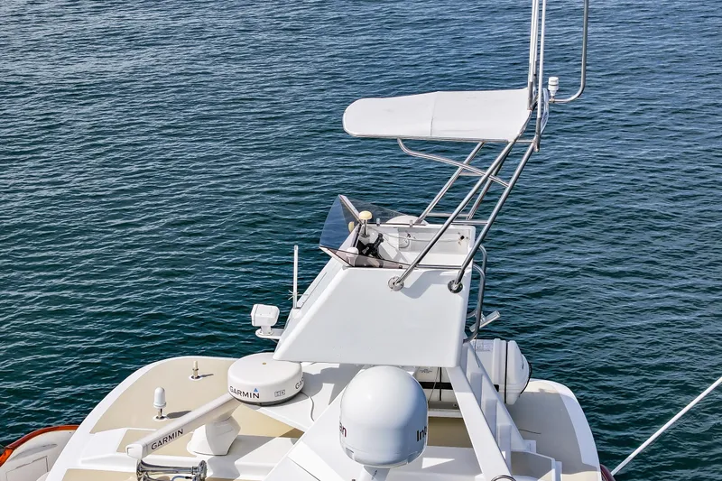 Slide: The Image of 1970 Hargrave Yachtfisher with navigation equipment on calm water. - 8