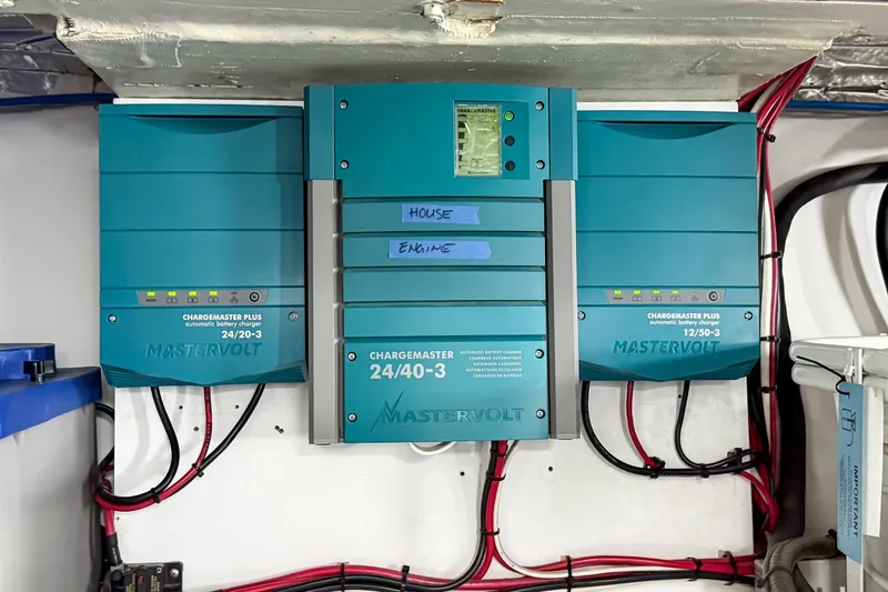 Slide: The Image of Mastervolt battery chargers in a 1970 Hargrave Yachtfisher, labeled for house and engine use. - 82