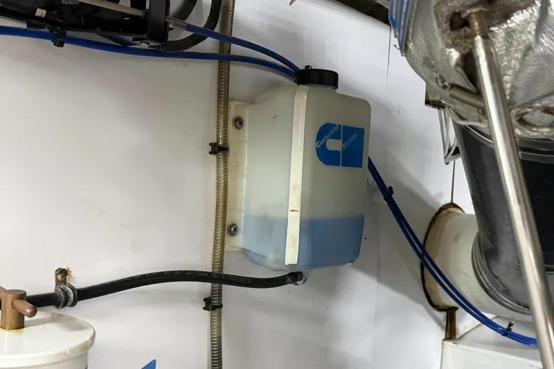 Slide: The Image of Engine compartment of a 1970 Hargrave Yachtfisher with Cummins Marine coolant reservoir. - 83