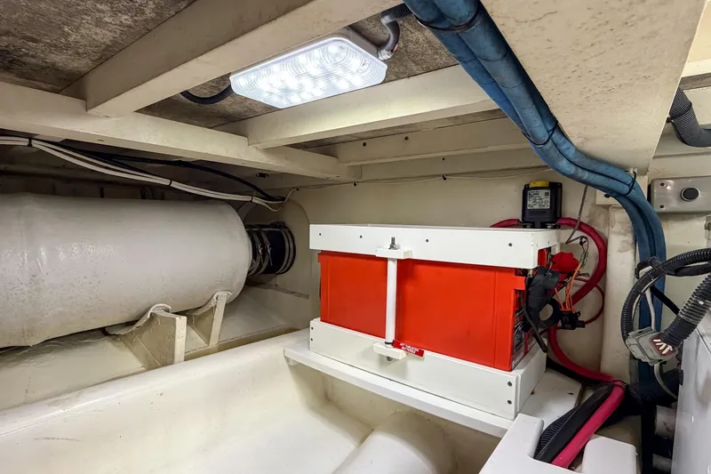 Slide: The Image of Engine room of 1970 Hargrave Yachtfisher with visible wiring and equipment. - 86