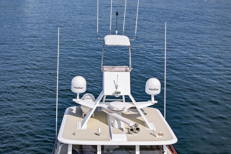 Slide: The Image of 1970 Hargrave Yachtfisher with advanced navigation equipment on calm blue waters. - 9