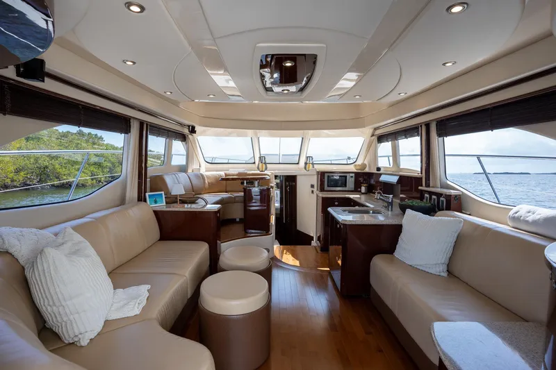 Slide: The Image of Luxurious interior of 2008 Sea Ray 520 Sedan Bridge yacht with elegant seating and modern amenities. - 11