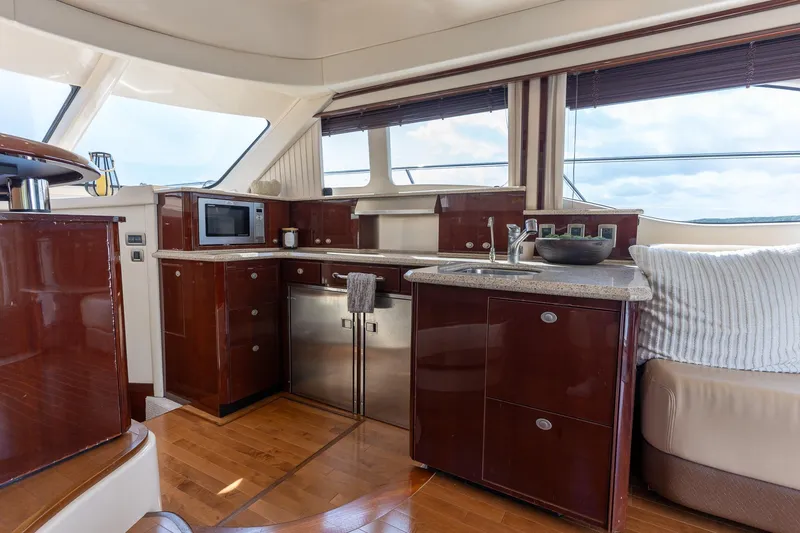Slide: The Image of Luxurious 2008 Sea Ray 520 Sedan Bridge yacht interior with modern kitchen amenities. - 13