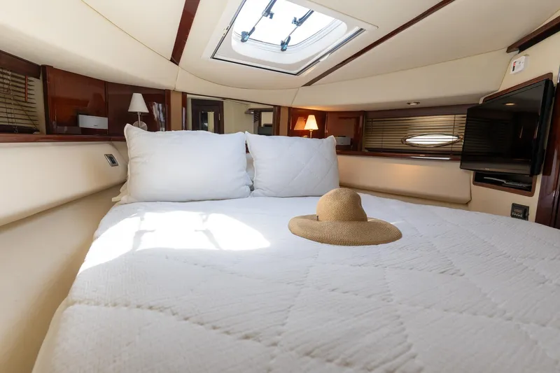 Slide: The Image of Luxurious 2008 Sea Ray 520 Sedan Bridge cabin with cozy bed and sun hat. - 20