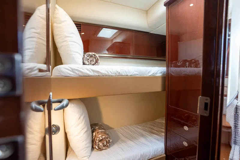 Slide: The Image of Luxurious 2008 Sea Ray 520 Sedan Bridge yacht cabin with cozy bunk beds. - 25
