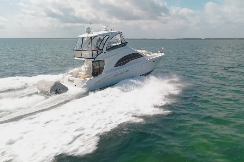 Slide: The Image of 2008 Sea Ray 520 Sedan Bridge yacht cruising on open water. - 3