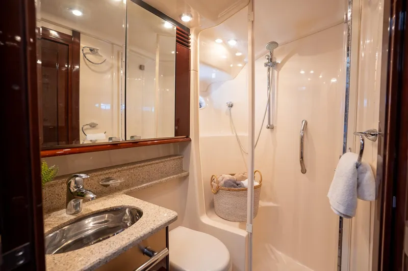 Slide: The Image of Luxurious bathroom in 2008 Sea Ray 520 Sedan Bridge yacht, featuring modern fixtures and elegant design. - 31