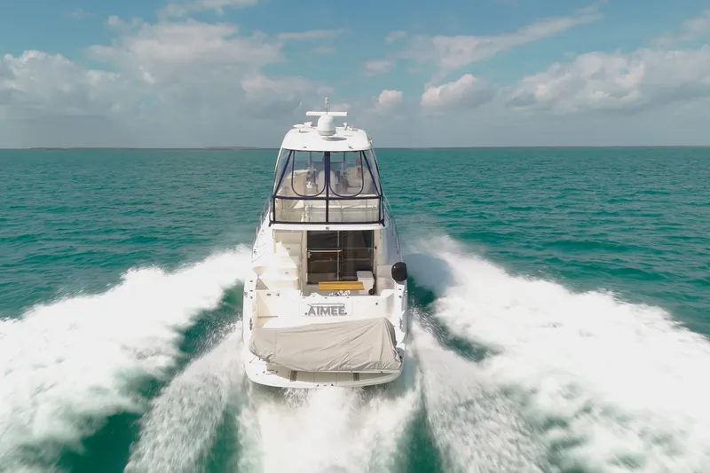 Slide: The Image of 2008 Sea Ray 520 Sedan Bridge cruising on open water, leaving a wake behind. - 4