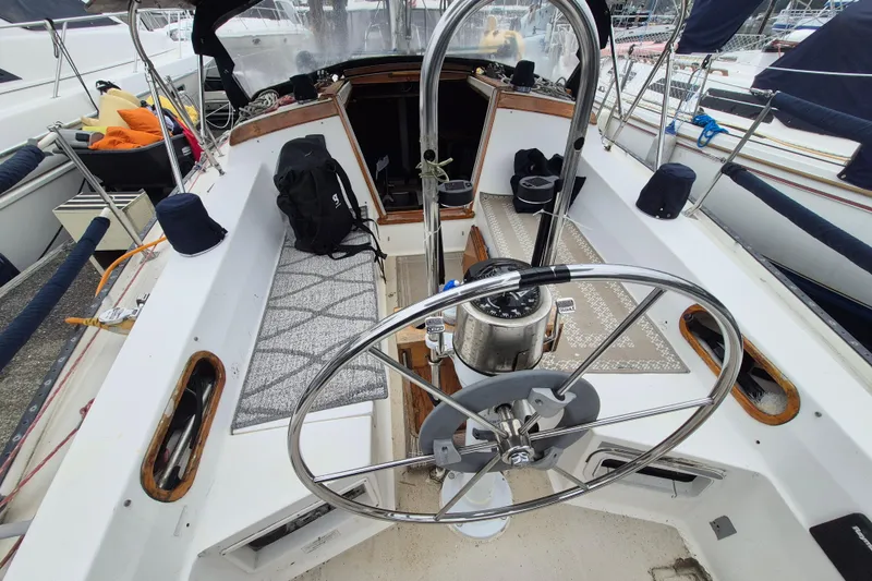 Slide: The Image of Cockpit of 1988 36 Catalina MK I sailboat with steering wheel and nautical equipment. - 5