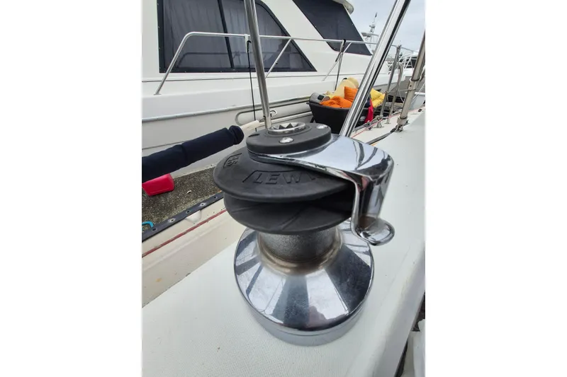Slide: The Image of Winch on 1988 36 Catalina MK I sailboat deck, with nearby yacht in background. - 6