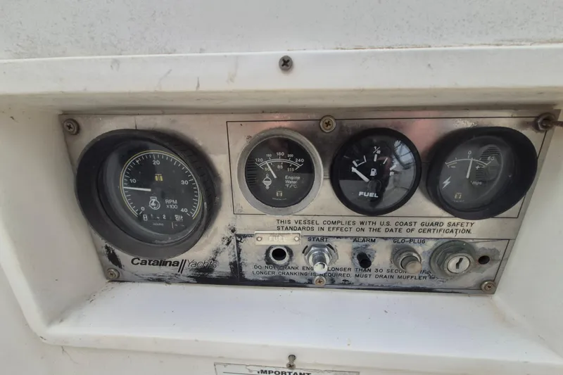 Slide: The Image of Control panel of a 1988 36 Catalina MK I yacht with gauges and switches. - 8