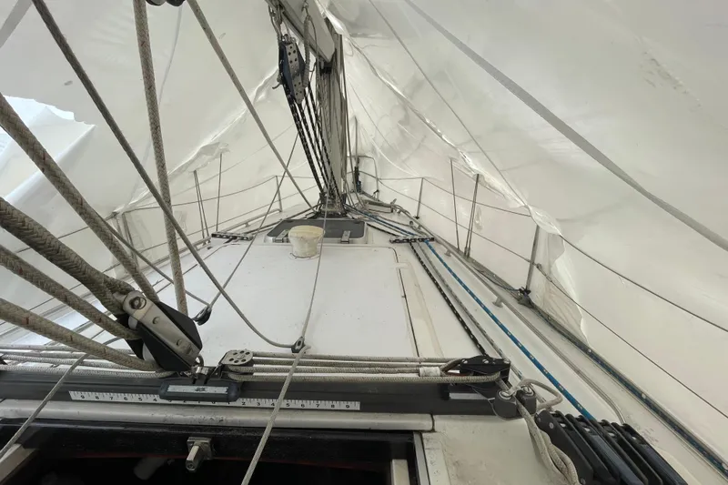 Slide: The Image of 1985 Canadian Sailcraft CS 30 sailboat interior with rigging and sails. - 13