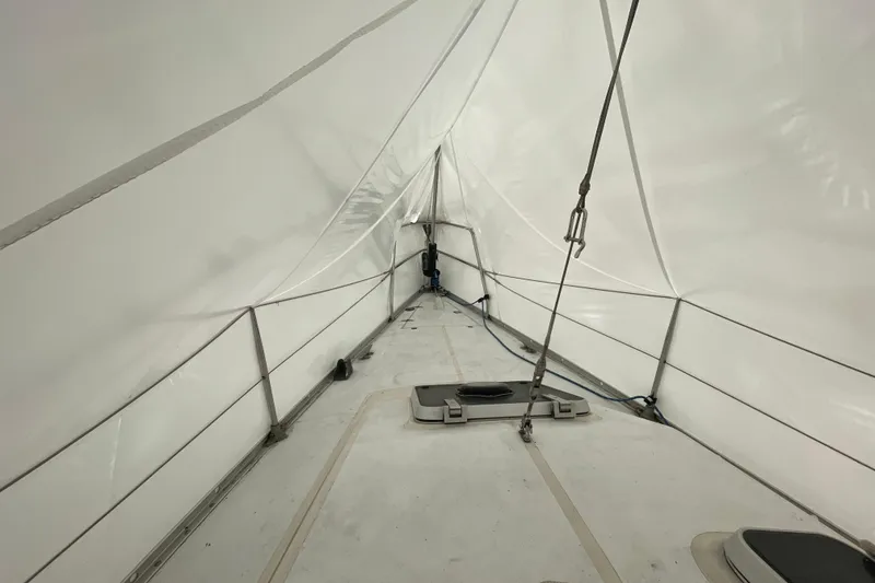 Slide: The Image of Interior view of a 1985 Canadian Sailcraft CS 30 sailboat under a protective cover. - 14