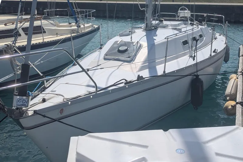 Slide: The Image of 1985 Canadian Sailcraft CS 30 sailboat docked in harbor. - 3