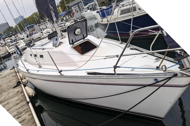 Slide: The Image of 1985 Canadian Sailcraft CS 30 sailboat docked in marina. - 6