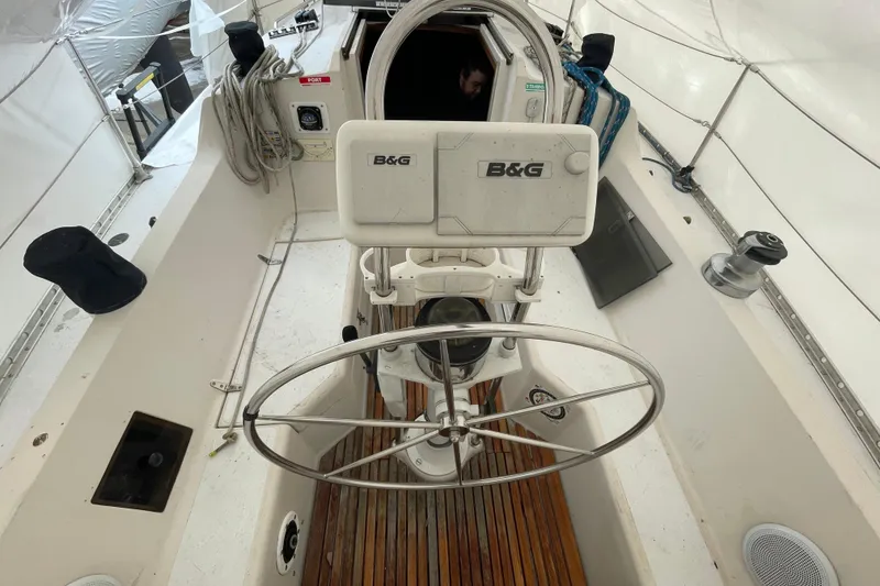 Slide: The Image of 1985 Canadian Sailcraft CS 30 cockpit with steering wheel and navigation equipment. - 9