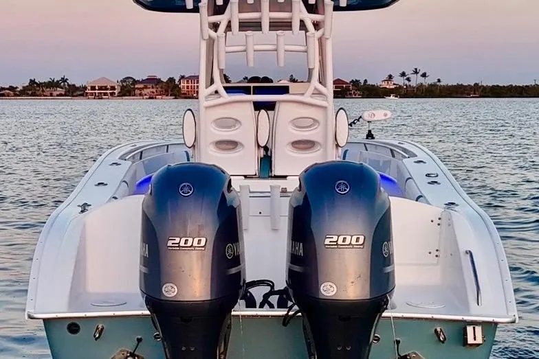 Slide: The Image of 2019 Cape Horn 27 boat with dual Yamaha 200 engines on calm water. - 22
