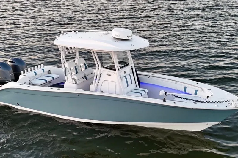 Slide: The Image of 2019 Cape Horn 27 boat on water, featuring sleek design and dual engines. - 6