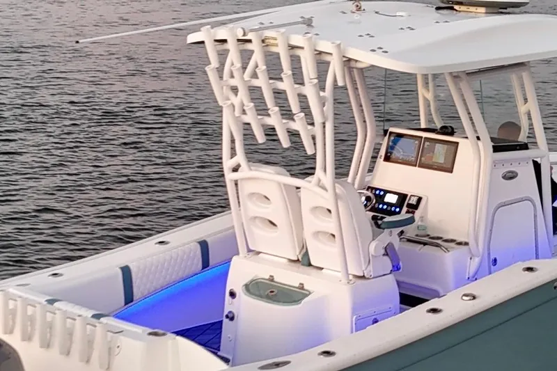 Slide: The Image of 2019 Cape Horn 27 boat with illuminated interior and advanced navigation system on calm water. - 27