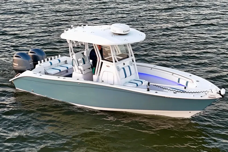 Slide: The Image of 2019 Cape Horn 27 boat on water, featuring dual engines and sleek design. - 7