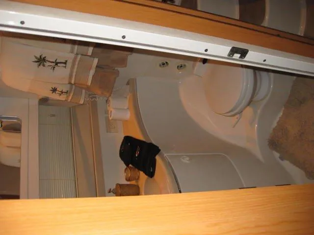 Slide: The Image of Engine compartment of a 2001 Regal Commodore 3880 boat with visible components and wiring. - 13