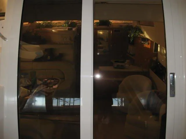 Slide: The Image of Luxurious interior of 2001 Regal Commodore 3880 yacht with plush seating and modern amenities. - 16