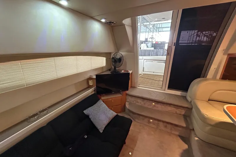 Slide: The Image of Interior of 2001 Regal Commodore 3880 yacht with cozy seating and modern amenities. - 19