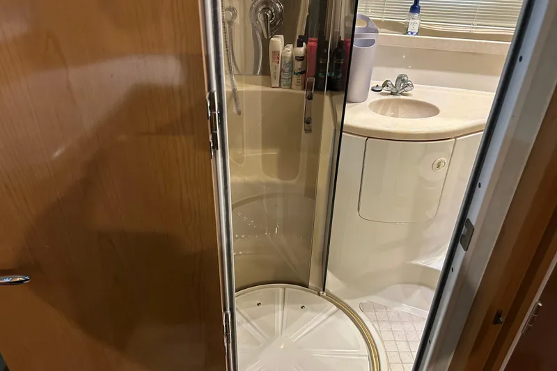 Slide: The Image of Bathroom interior of 2001 Regal Commodore 3880 yacht, featuring shower and sink. - 24
