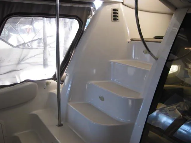 Slide: The Image of 2001 Regal Commodore 3880 yacht docked under a covered marina. - 3