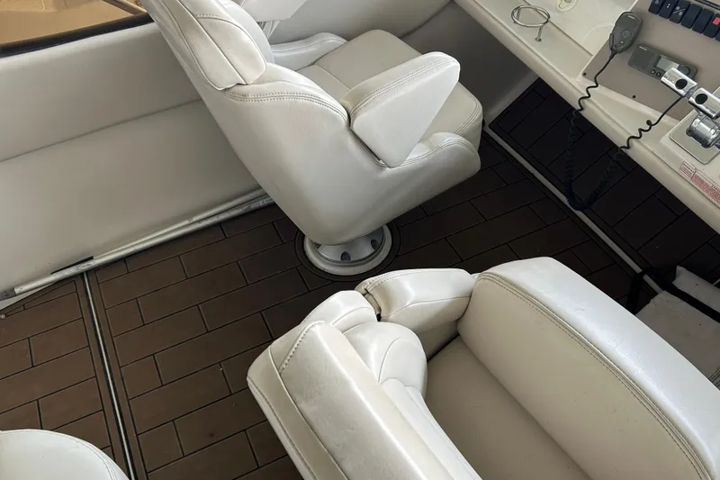 Slide: The Image of White leather seats in a 2001 Regal Commodore 3880 boat interior. - 35