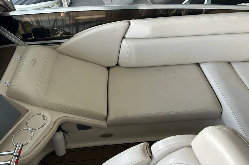 Slide: The Image of 2001 Regal Commodore 3880 boat interior with beige leather seating and cup holders. - 36