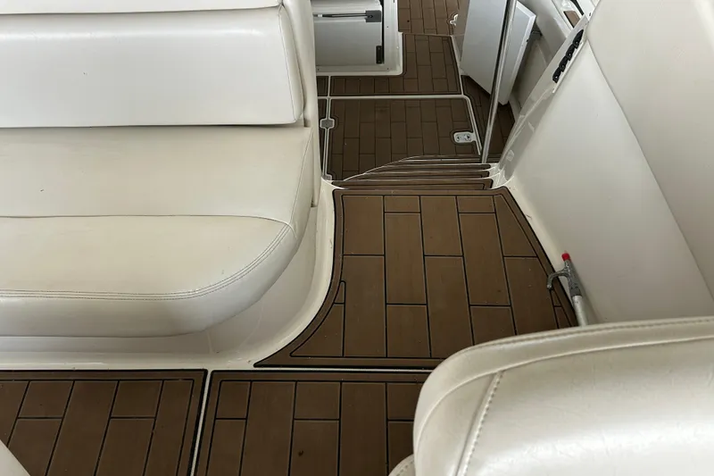 Slide: The Image of 2001 Regal Commodore 3880 interior with white seating and wood-patterned flooring. - 38