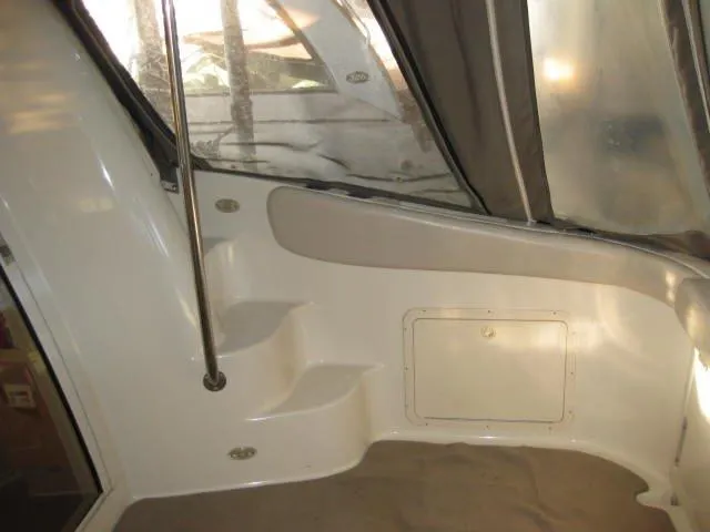 Slide: The Image of 2001 Regal Commodore 3880 yacht docked in a marina, rear view. - 4