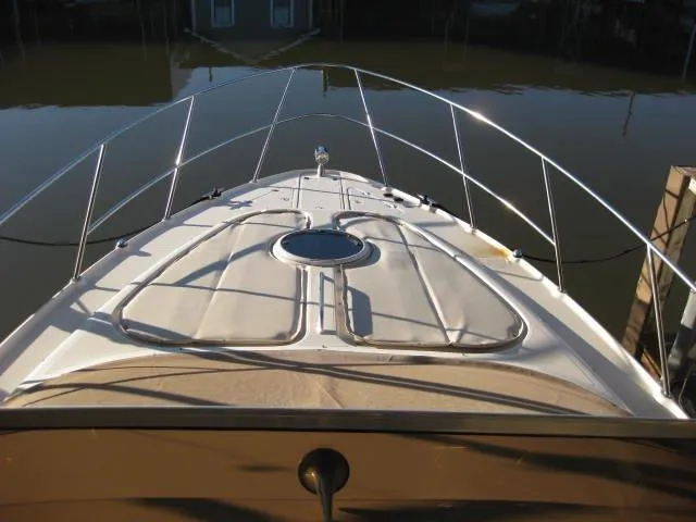 Slide: The Image of 2001 Regal Commodore 3880 boat docked, displaying registration TX 1233 KC. - 5