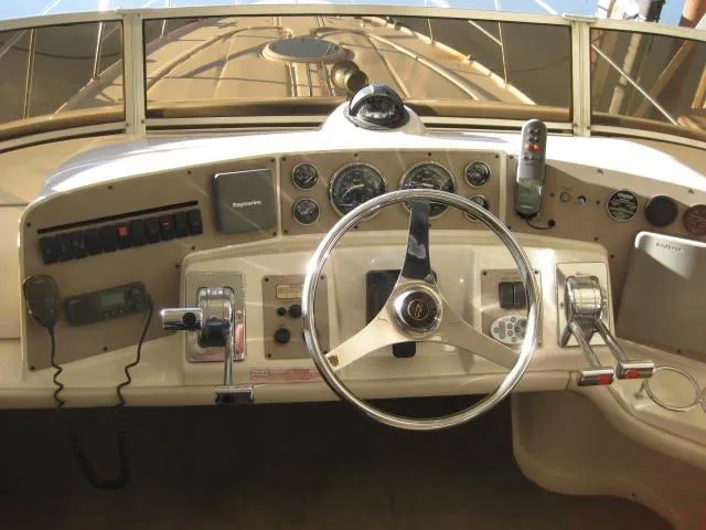 Slide: The Image of 2001 Regal Commodore 3880 yacht in covered storage, showcasing sleek design and protective covering. - 6