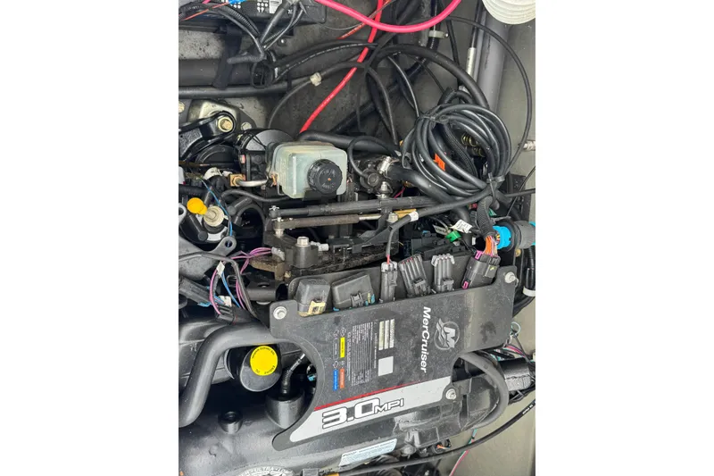 Slide: The Image of Engine of 2010 Larson LX 1750 boat, featuring MerCruiser 3.0 MPI system. - 12